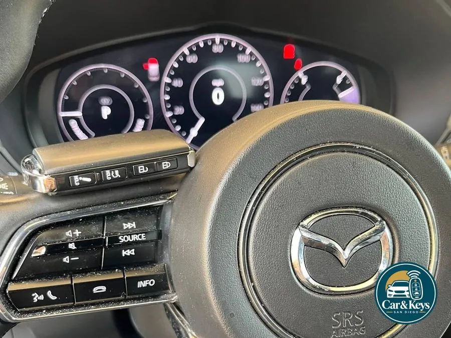 A Mazda key programmed at the wheel